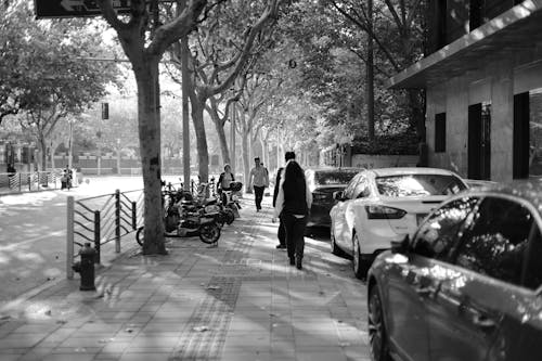 People Walking on Sidewalk