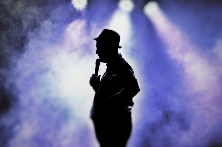 Man Holding Microphone Silhouette