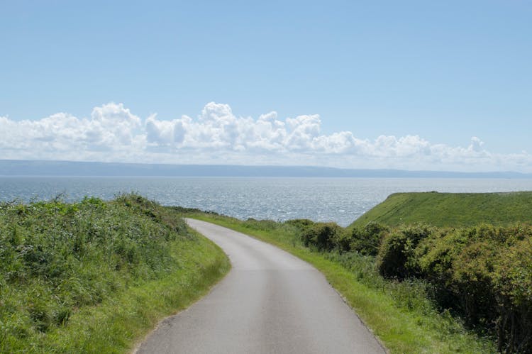 Country Road Near Body Of Water