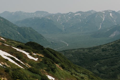 Green Mountains Under Gloomy Sky