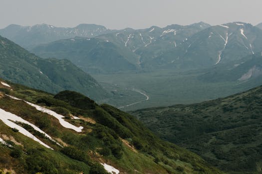 Scenic view of lush green mountains and valleys in Kamchatka, Russia.