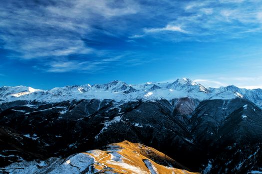 Stunning view of snow-capped mountain range in Chechnya, capturing the breathtaking winter landscape.