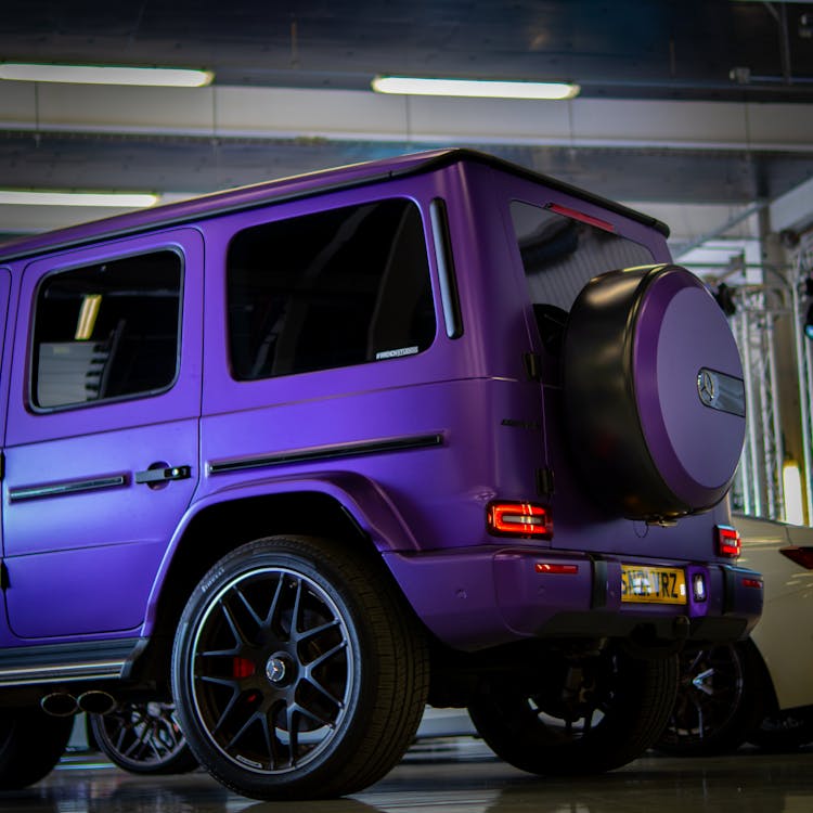 A Purple And Black Suv