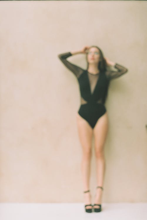 Free Blurry Photo of a Woman in a Black Swimsuit  Stock Photo