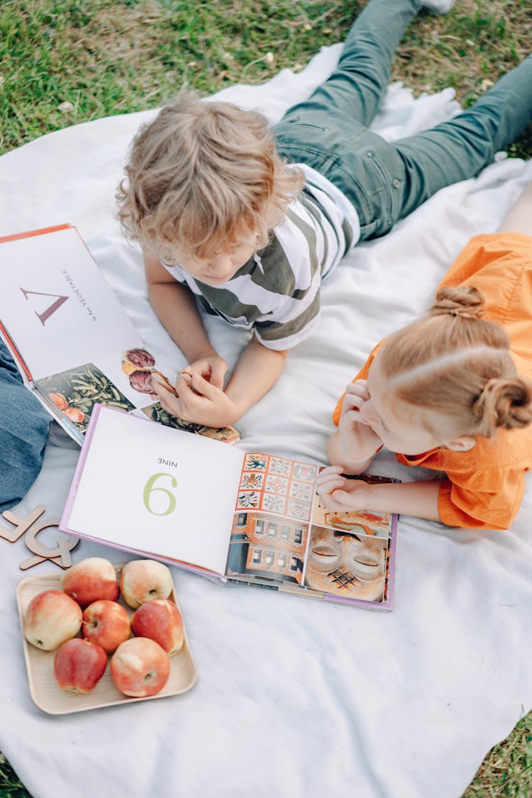 Top View Of A Girl And Boy Studying Together