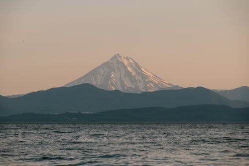 A Mountain Near the Body of Water Under the Clear Sky