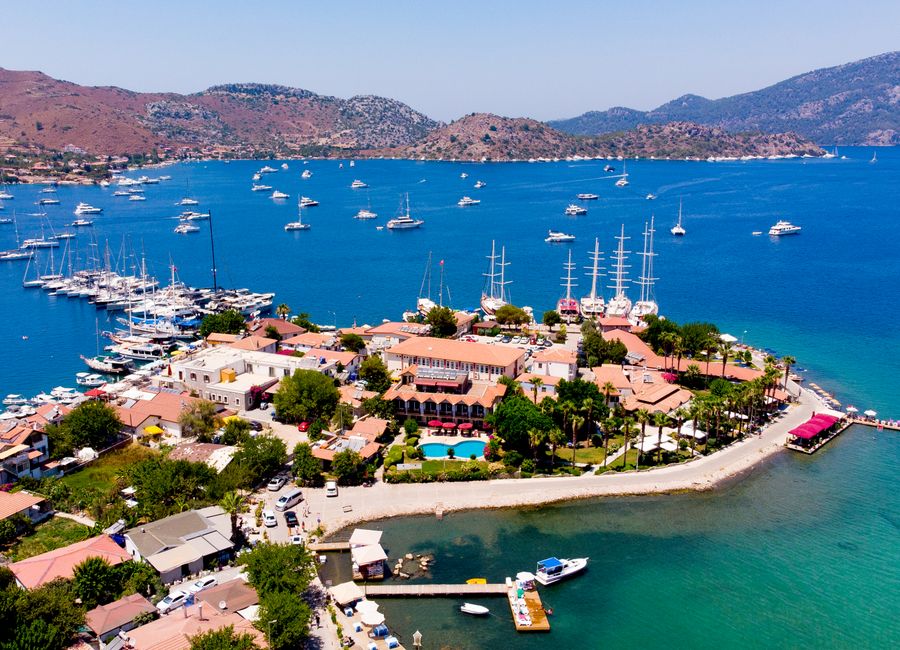 Stunning aerial photo of Marmaris marina with yachts and blue waters.