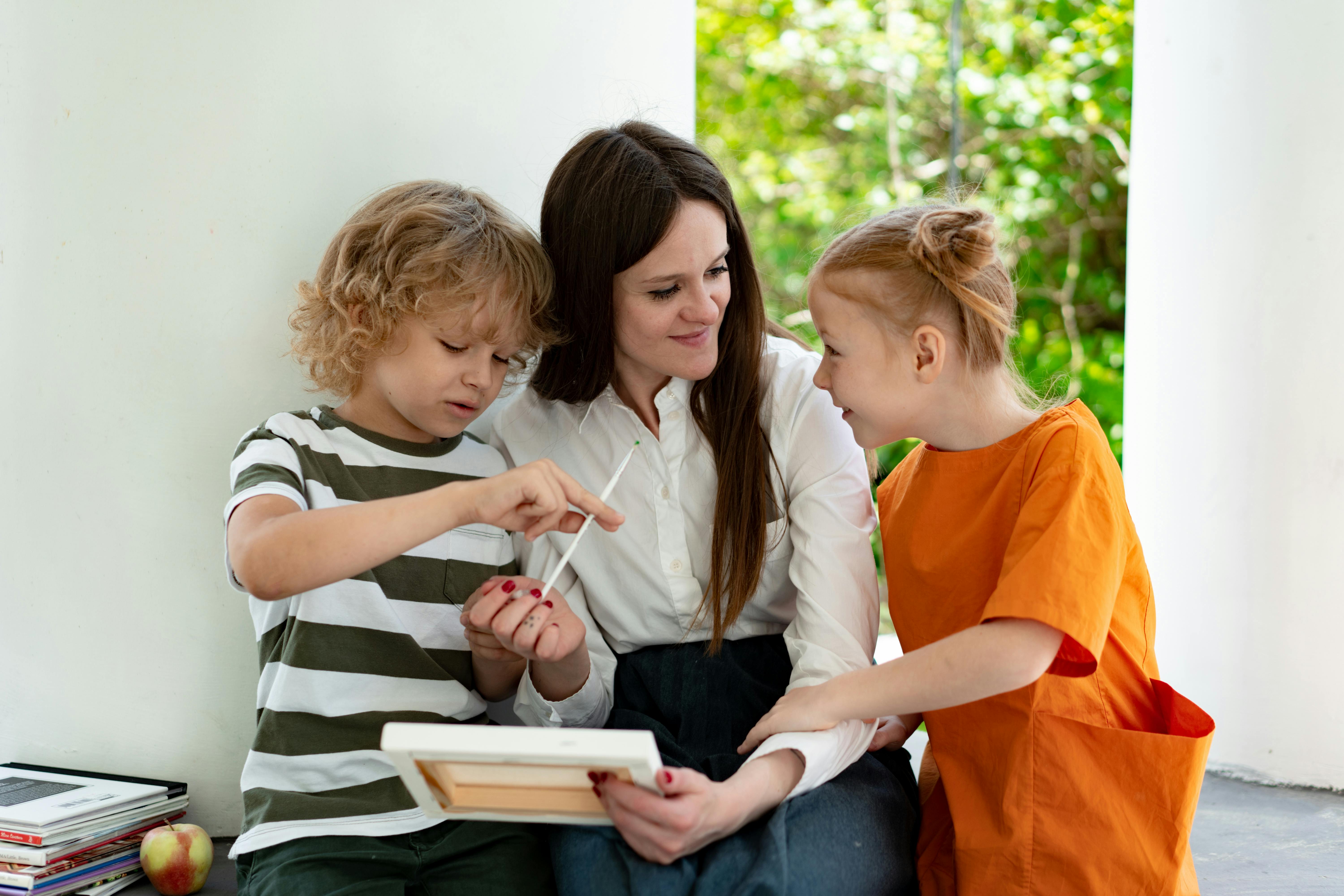 a mother and children painting