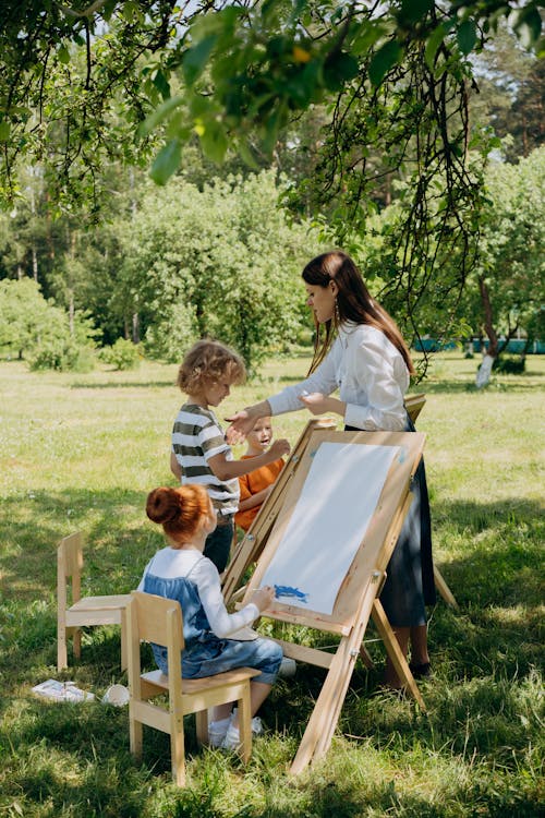 Free Kids Doing Painting Activity Outside  Stock Photo