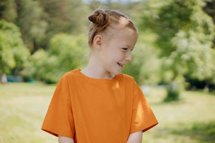 A Girl Wearing An Orange Shirt