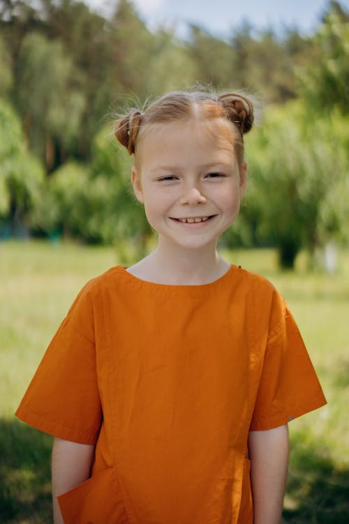 A Girl Wearing an Orange Shirt
