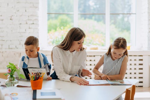 A Woman and Kids Reading Books