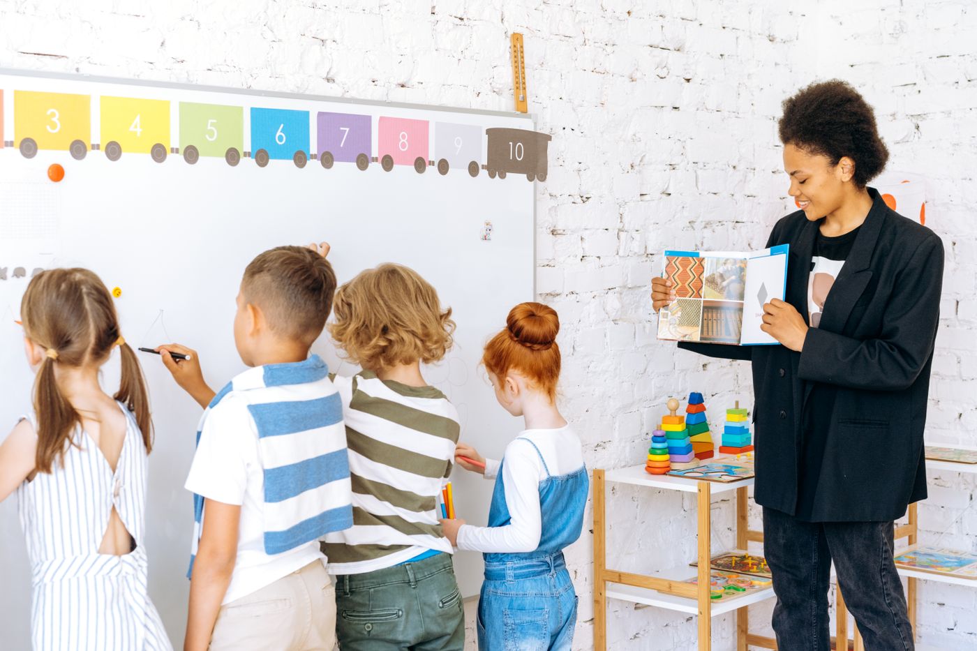 TEFL certified teacher leading an English lesson with young students during a gap year teaching placement