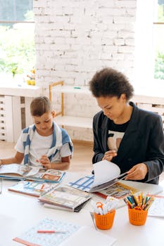 A teacher and student collaborate on reading activities in a sunlit classroom.