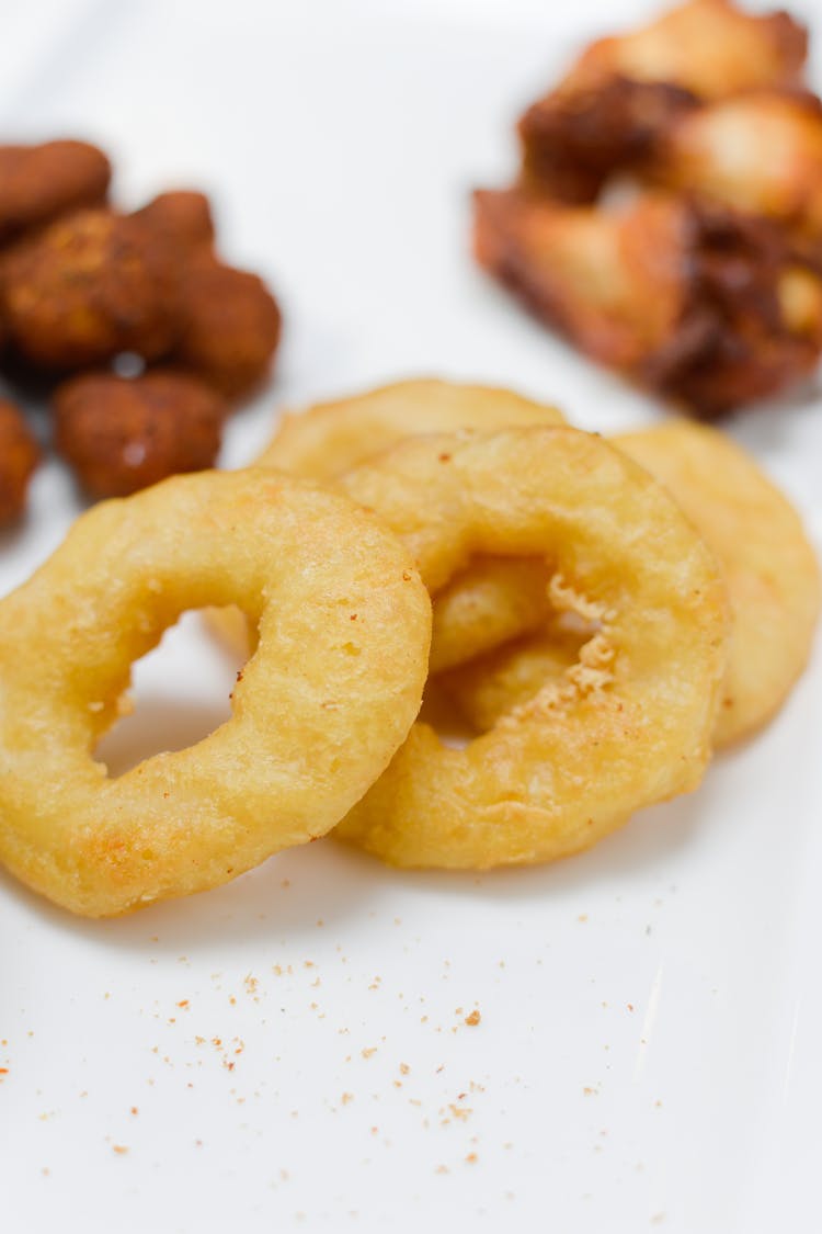 Apple Fritter Rings On White Ceramic Plate