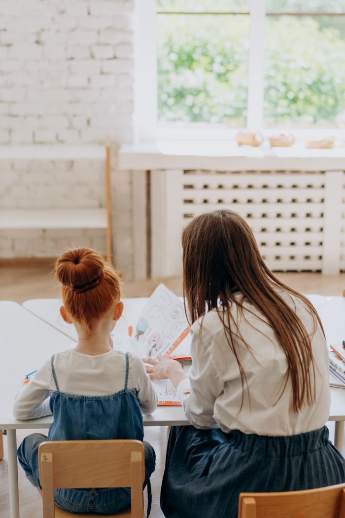 Parent and child working together at home