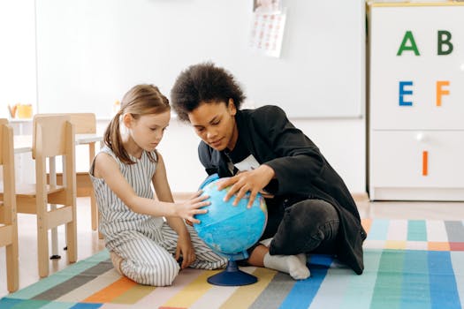 Two children engaged in learning with a globe in a classroom environment.