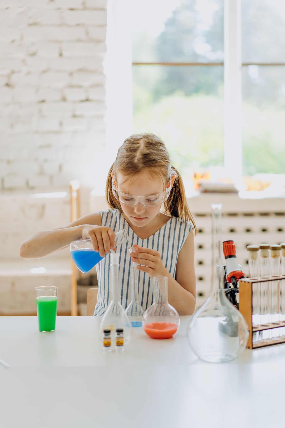 A young student carrying out a hands-on science experiment.