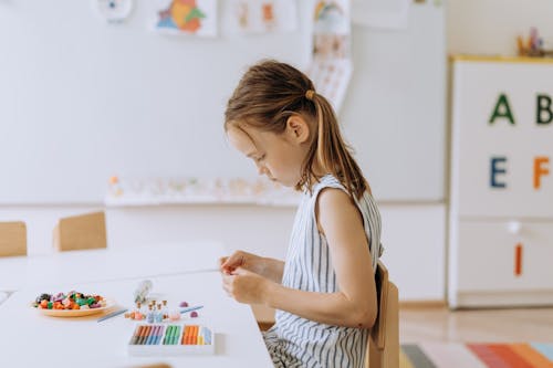 A Girl Playing Colorful Clay