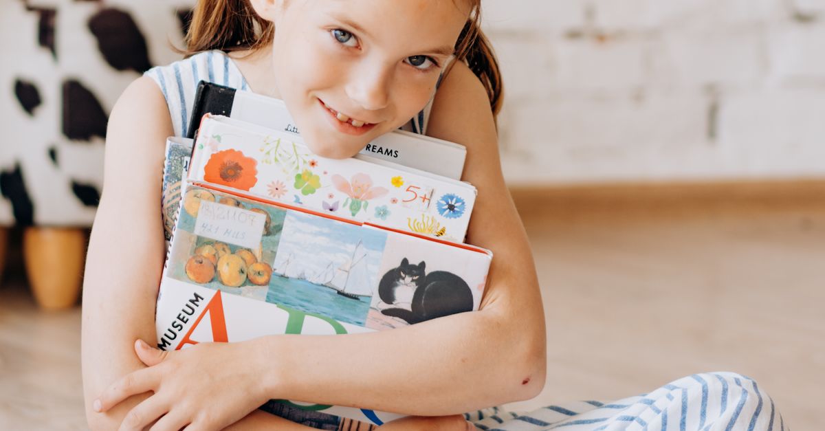 Hugging Books A Girl Hugging Books · Free Stock Photo