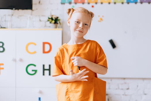 A cheerful girl holding a pencil in a colorful classroom setting, inspiring positivity.