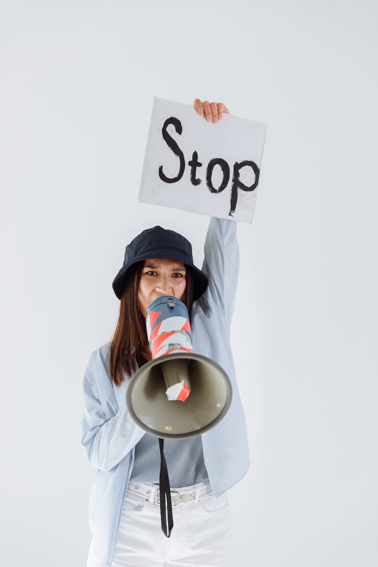 A Woman Protesting While Holding A Megaphone