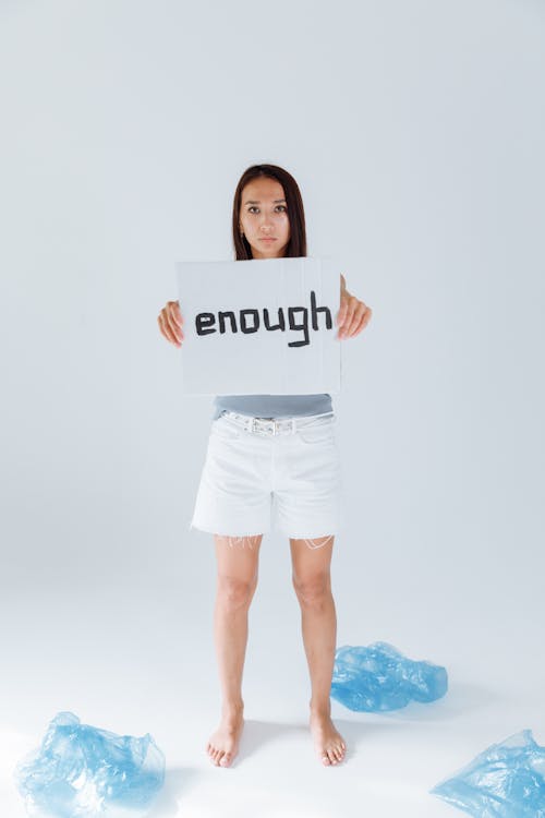 Woman Holding a Sign