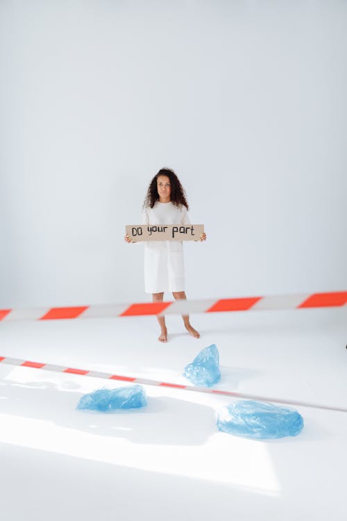 Woman Holding a Sign