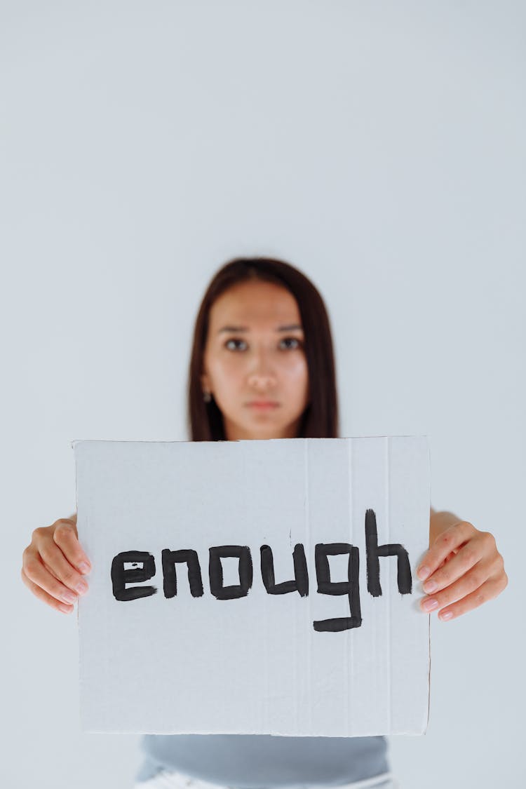 Woman Holding A Sign 