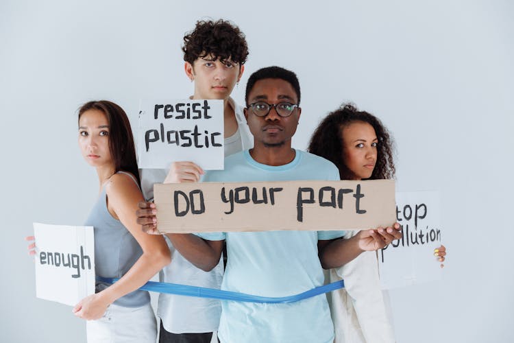 Group Of People Holding Protest Signs