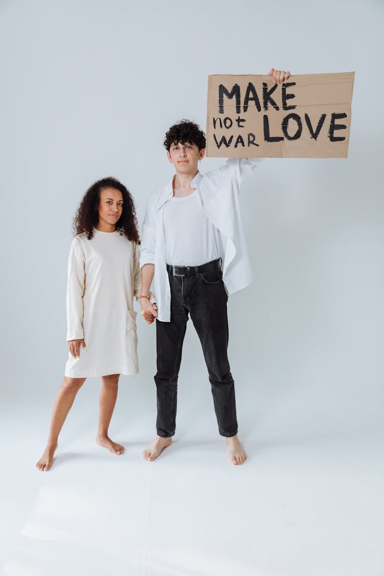 Activist Couple Holding A Placard