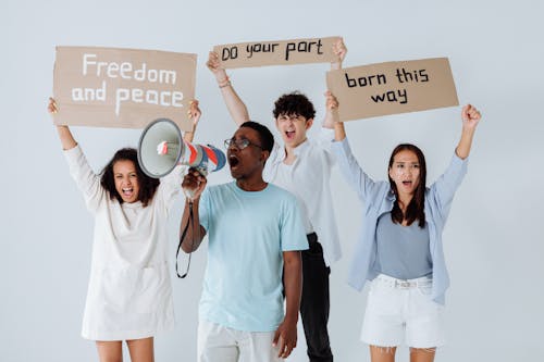 Free Group of People Holding Protest Signs Stock Photo