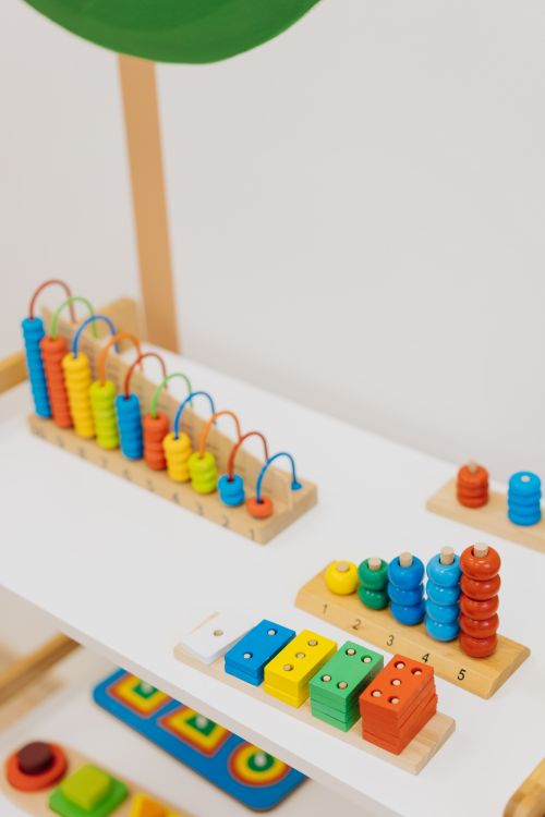 Bright educational wooden toys on a shelf