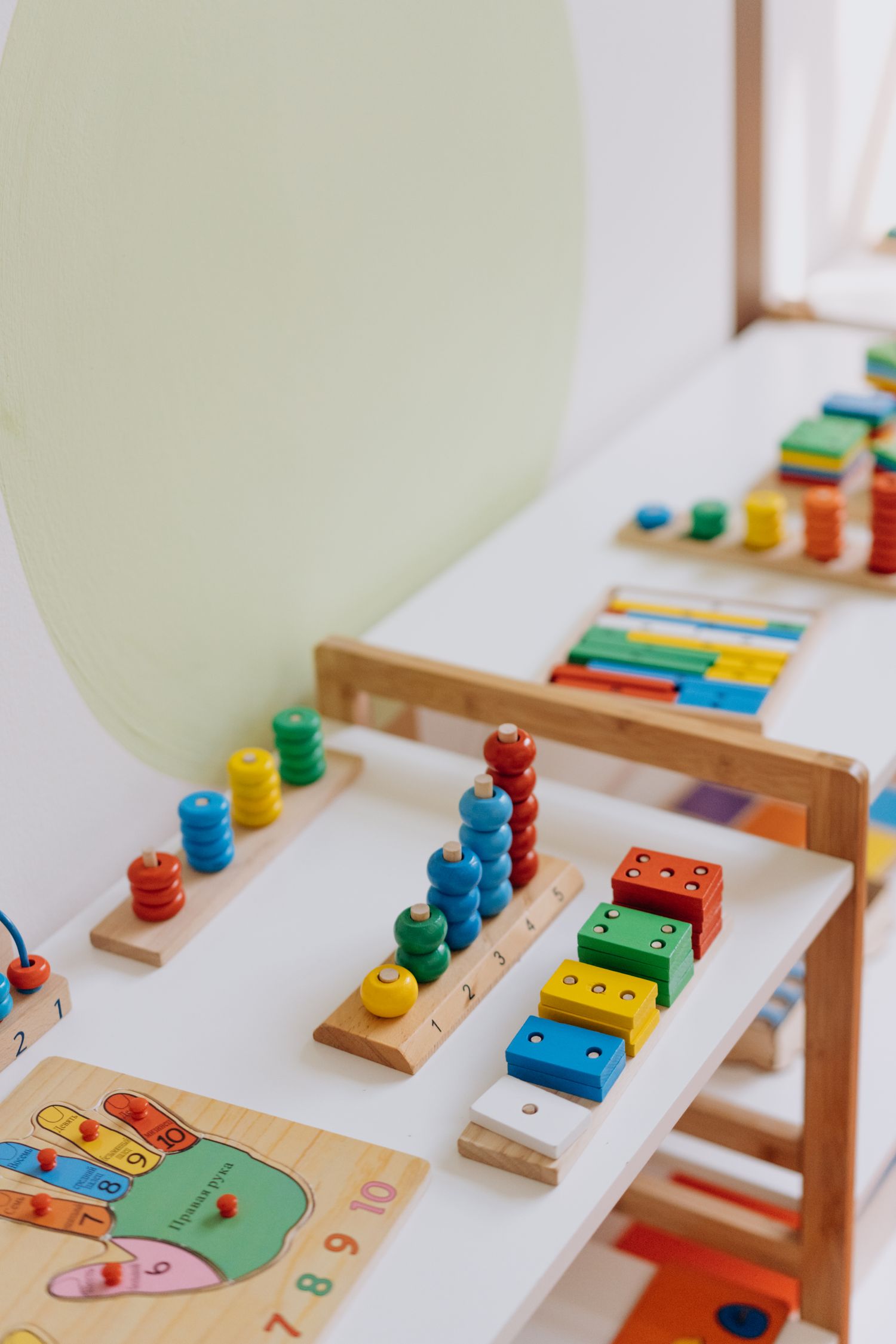 Wooden Montessori materials laid out on a table