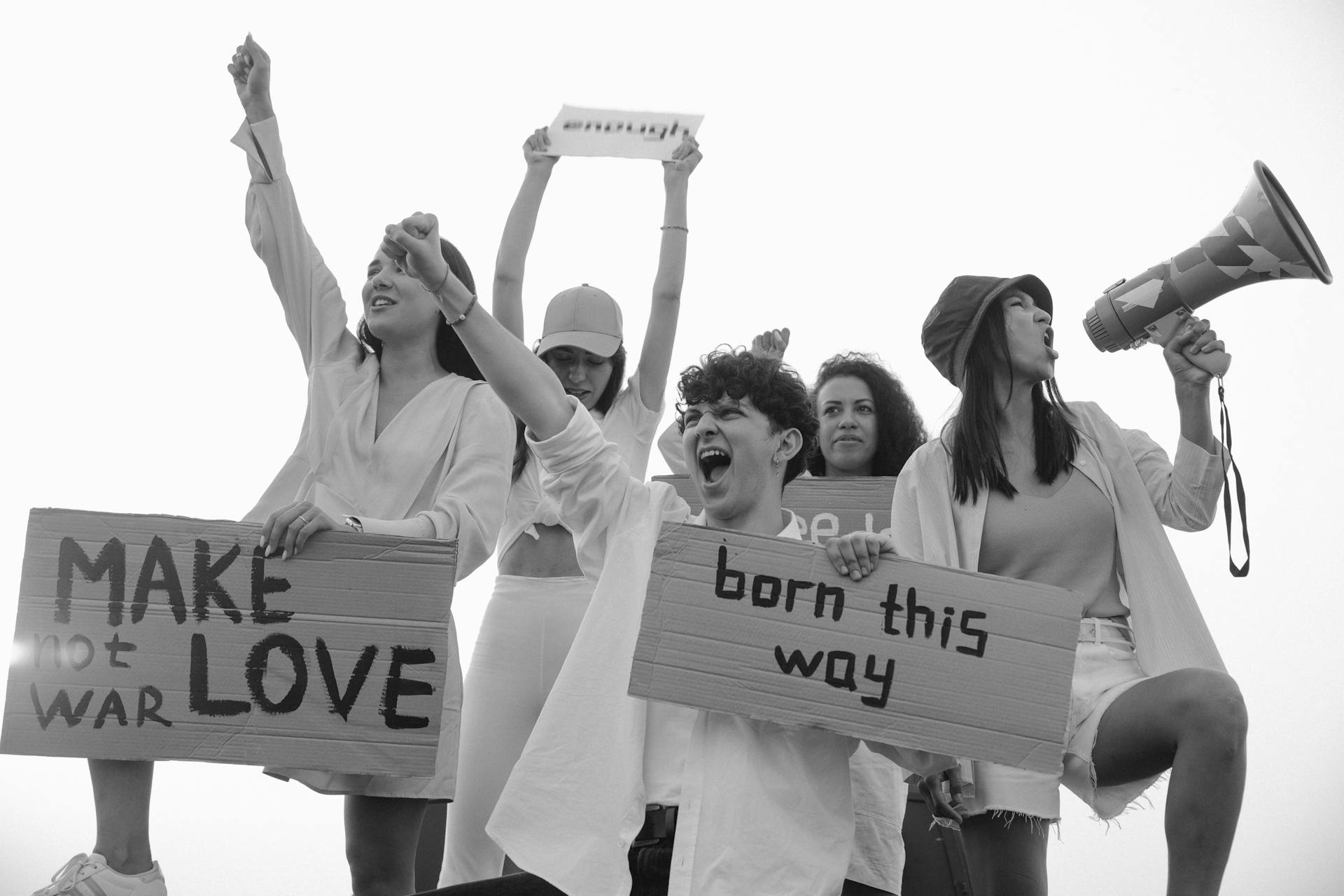 People Holding Signages