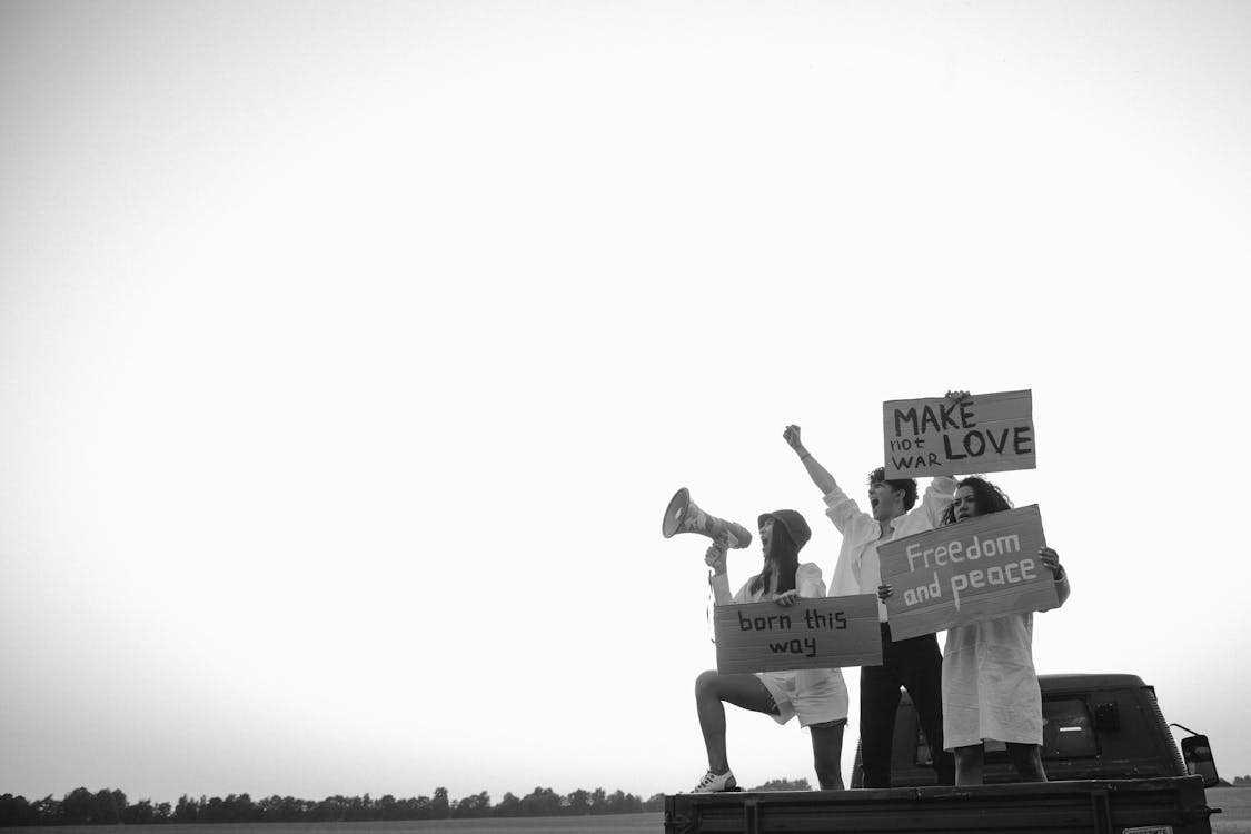 Free Grayscale Photo of People Holding Signages Stock Photo