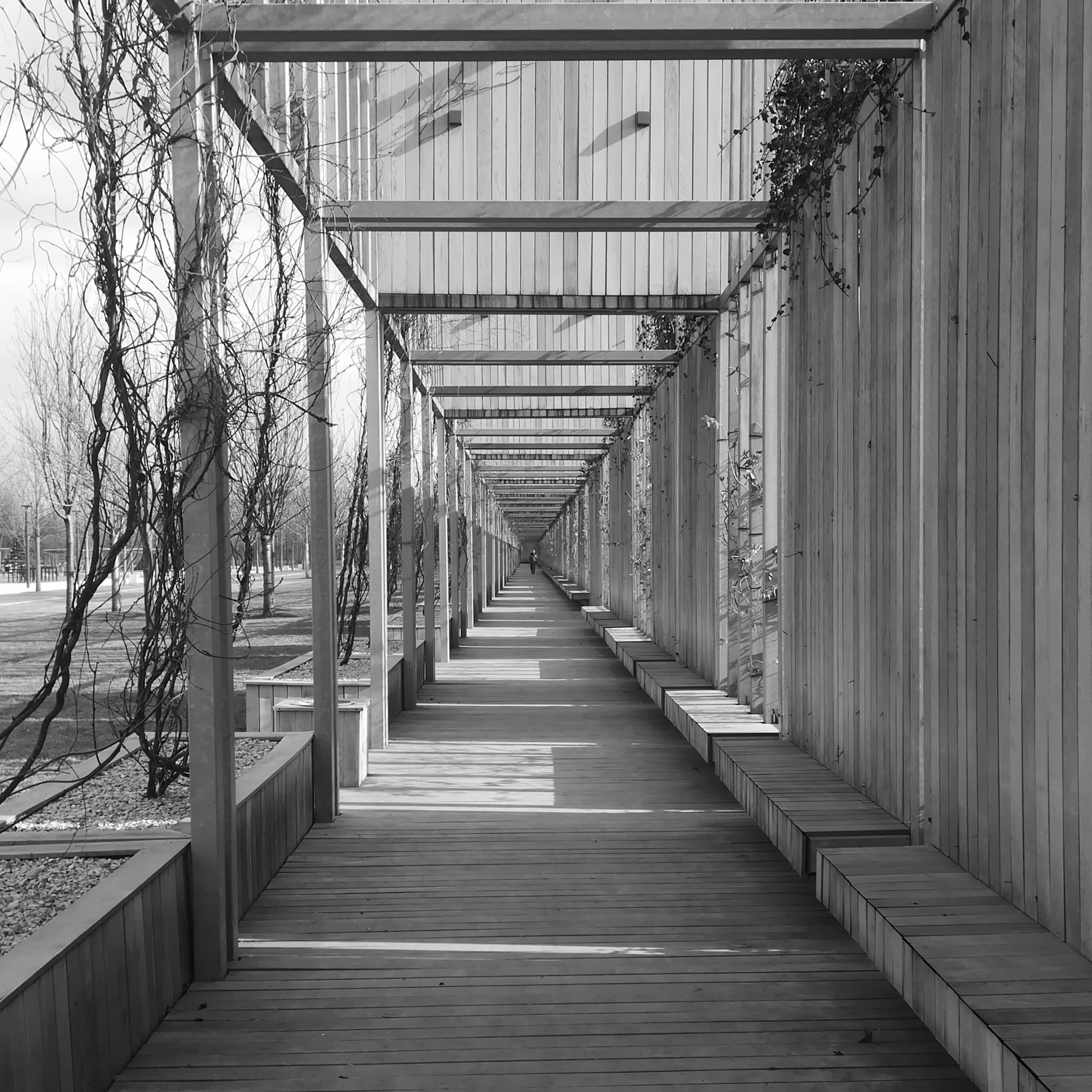 A Wooden Pathway on the Sidewalk
