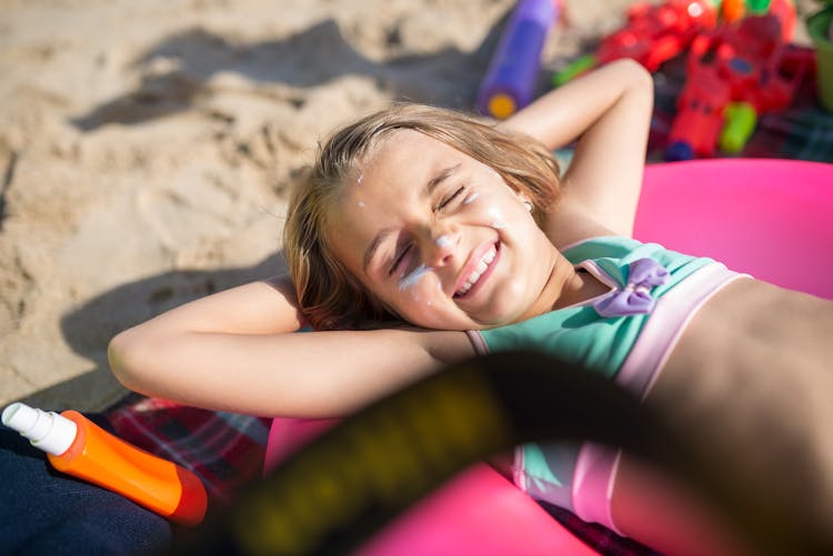 Beautiful Girl Wearing A Swimsuit Sunbathing