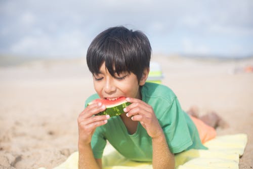 Free Young Boy Eating Watermelon Stock Photo