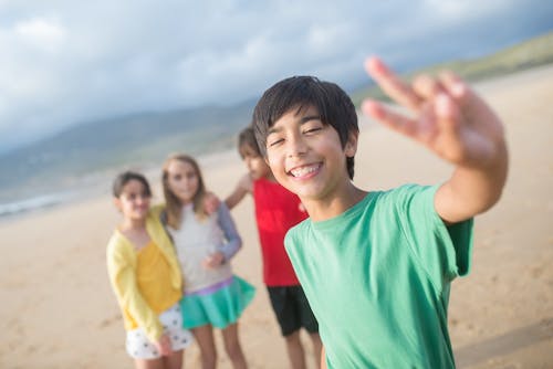 A Boy with Girls on a Beach