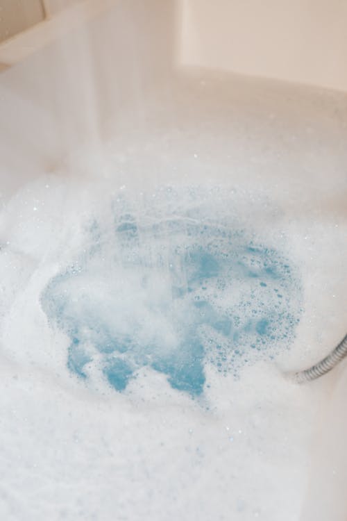 Free Bathtub Full of White Foam and Bubbles  Stock Photo