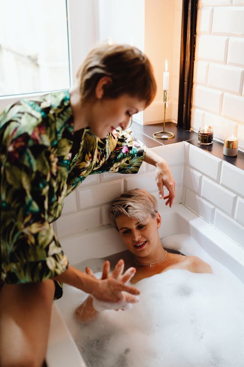 A Couple Holding Hands in the Bathroom