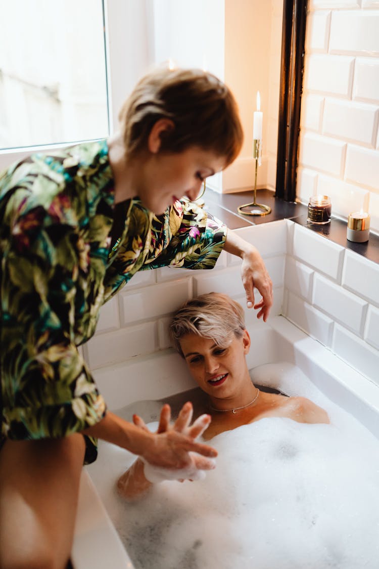 A Couple Holding Hands In The Bathroom