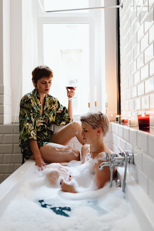 Women Spending Time Together in a Bathroom