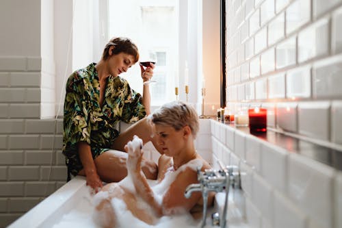 
Women Spending Time Together in a Bathroom