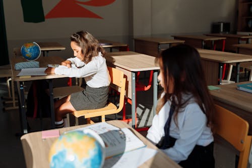 Free Two Students Studying Inside the Classroom Stock Photo