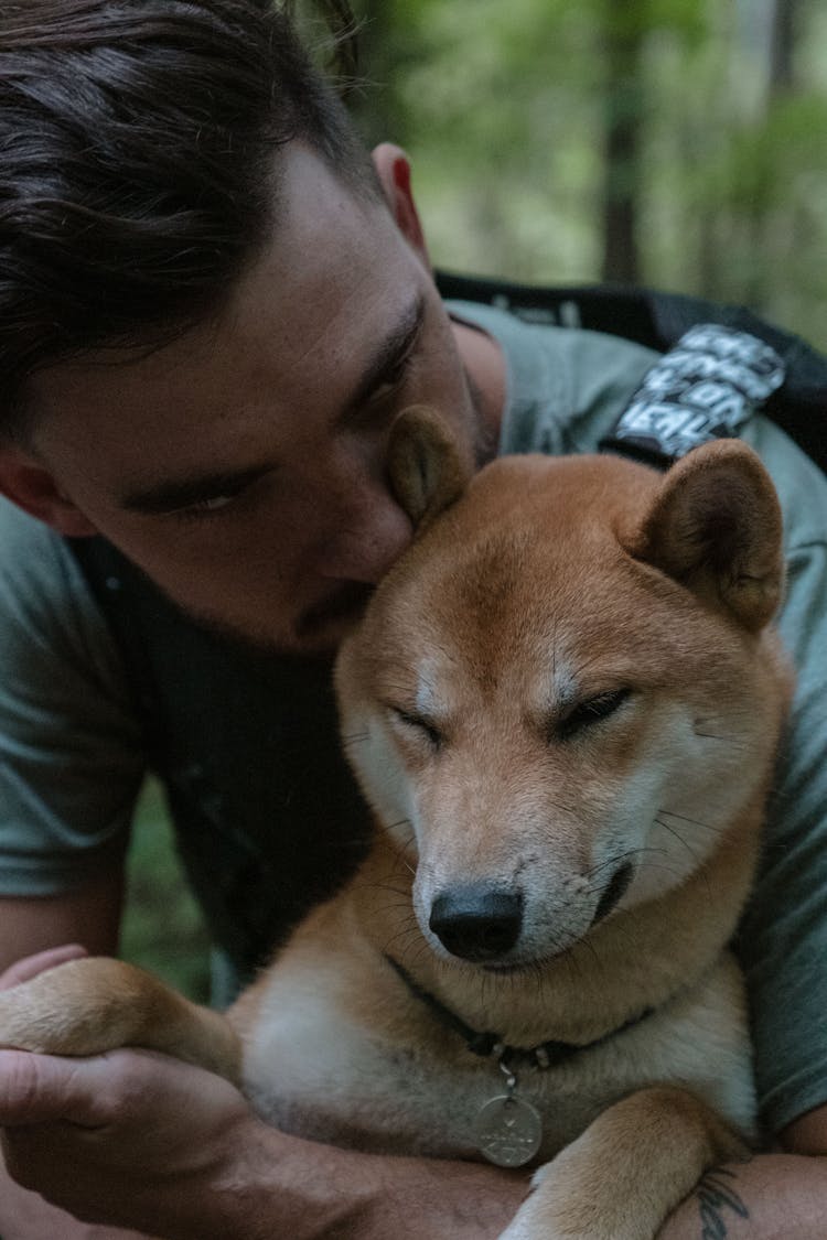 Man Kissing His Dog