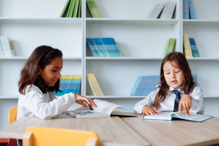 Students Reading Books In A Library