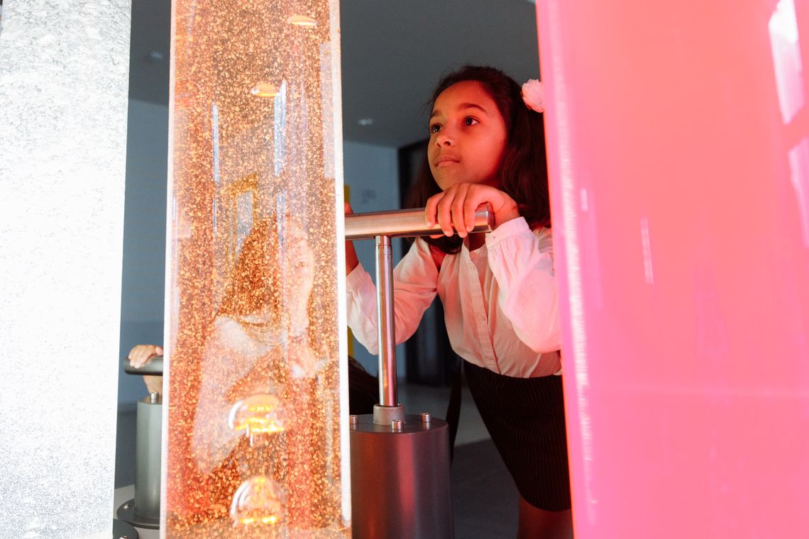 Child exploring a hands-on science and technology activity