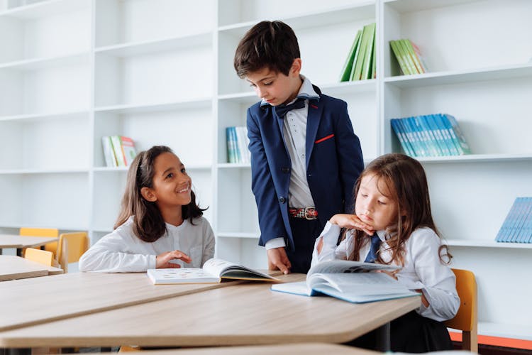 Students Reading Books In A Library